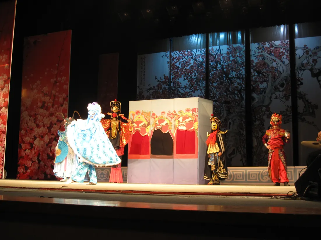 A Sichuan opera performer in an elaborate embroidered costume